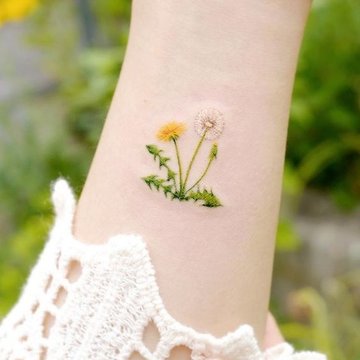 Paardenbloem tattoo