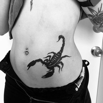 Schorpioen tattoo